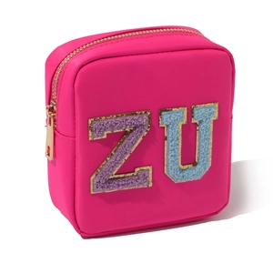 Pink nylon cosmetic bag with Z and U chenille patches and golden zipper closure