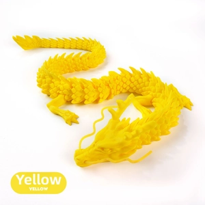 Detailed close-up of a yellow 3D printed dragon with articulated joints and lifelike scales