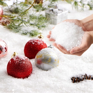 Artificial white snow powder for Christmas decoration with pine cones and festive ornaments