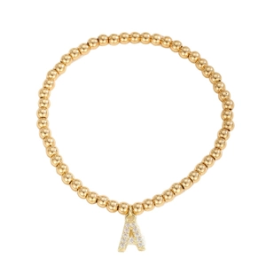 Minimalist gold beaded bracelet with a sparkling crystal-encrusted letter A pendant