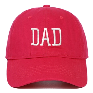 Close-up of red cotton baseball cap with detailed white DAD embroidery on front