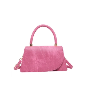 Chic peach pink textured fabric mini crossbody bag with asymmetric flap and top handle