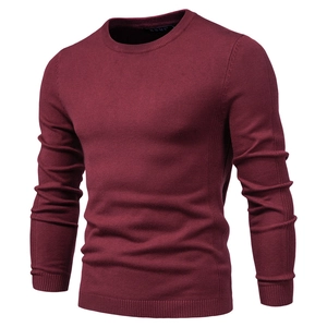 Close-up of wine red men's crew neck sweater showing the detailed slim fit knit texture