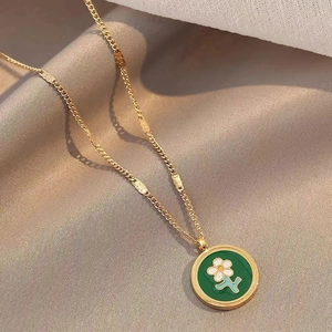 French vintage daisy necklace with green floral pendant on a gold plated chain