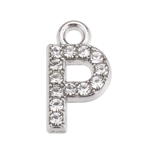 Macro shot of silver crystal-studded letter P charm pendant for DIY jewelry making