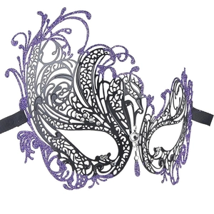 Close-up of purple glitter masquerade mask with intricate black cutouts and rhinestones
