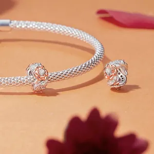 925 sterling silver mesh bracelet with rose gold flower charm and sparkling cubic zirconia