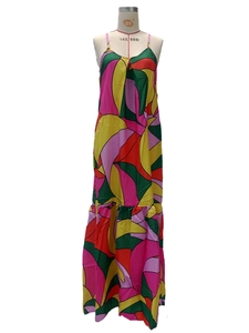 Detail of French floral maxi dress featuring deep V-neck and vibrant geometric patterns