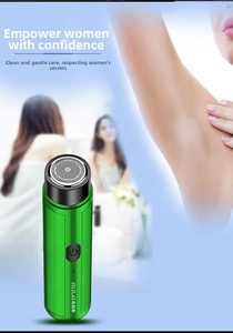 Close-up of the portable electric shaver featuring a green metallic body and honeycomb mesh foil