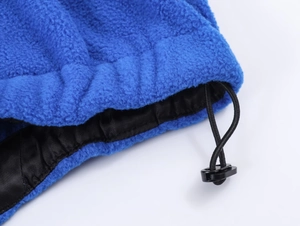 Detail of royal blue fleece texture with black lining and plastic drawstring toggle