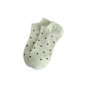 Beige low cut invisible socks with black polka dots and vertical ribbed cotton texture