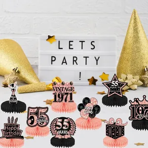 Rose gold 55th birthday table centerpieces featuring 1971 vintage honeycomb decorations