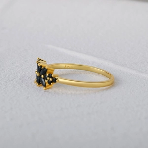 Close-up of gold-plated S925 silver ring featuring marquise-cut black gemstones detail