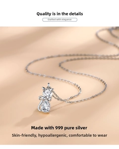 Macro view of 999 sterling silver cat pendant with sparkling cubic zirconia stones