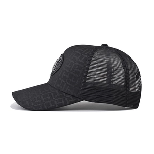 Detail of black mesh trucker hat featuring embroidered H monogram and textured visor