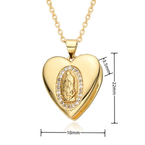 Close-up of gold heart locket necklace with Virgin Mary relief and crystal inlay