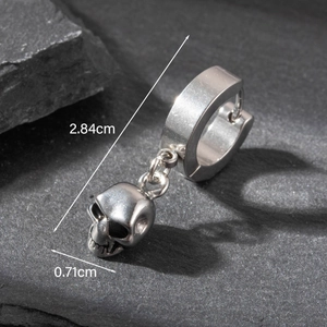 Macro view of silver skull earring with dimensions 2.84cm length and 0.71cm width detail