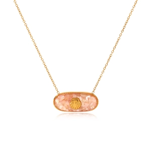 Macro detail of gold stainless steel necklace with pink oval shell pendant and shell motif