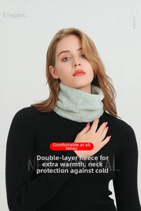 Close-up of mint green faux rabbit fur neck warmer with thick double-layer plush texture