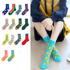 Detail view of assorted cotton mid-calf socks featuring vibrant fruit and pizza patterns