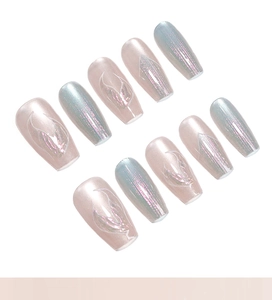 Macro detail of aurora mermaid press-on nails with holographic shimmer and wing patterns