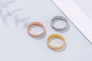 Detailed comparison of triple-color titanium steel rings with pavé diamonds and chain inlays