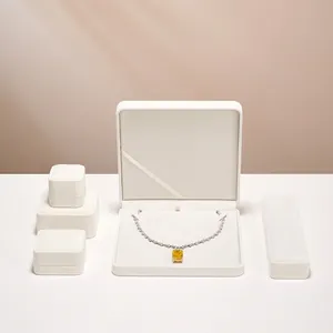 Elegant cream velvet jewelry box set for necklaces and rings with minimalist design