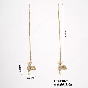 Detail view of gold hummingbird ear threads with zircon stones and size dimensions
