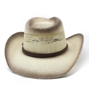 Detail of western cowboy hat with hollow weave patterns and brown gradient finish