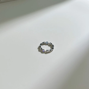 Macro detail of S925 sterling silver ring with marquise-cut cubic zirconia stones