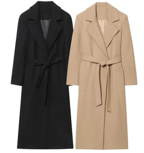 Detail of wool blend coat showing lapel collar and matching belt in black and beige