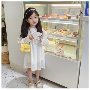 Cute white dress paired with yellow mini crossbody bag and pearl chain for girls