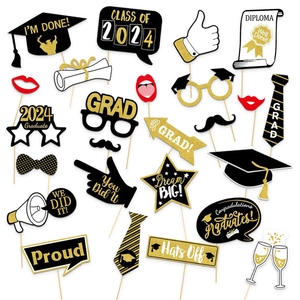 Detailed flat lay of 2024 graduation photo booth props including caps, ties and glasses