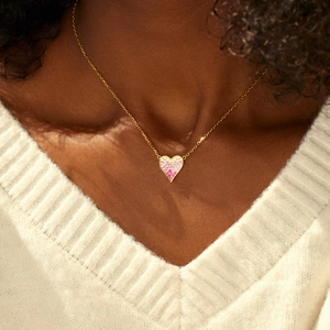 Close-up of heart necklace with pink and purple gradient cubic zirconia stones