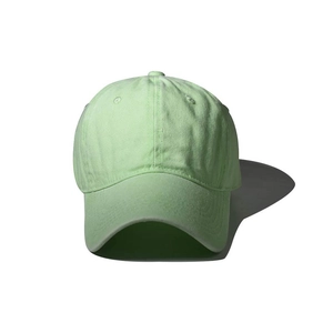 Detail of light green cotton baseball cap showing six-panel crown and curved brim