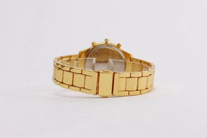 Detail of gold metal watch strap showing the secure clasp and three side crowns