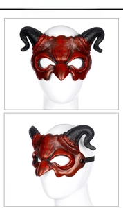Close-up of bronze-red devil horn mask with realistic faux leather texture and elastic strap