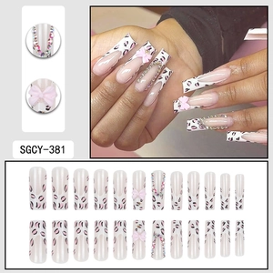 Long coffin leopard print press-on nails with pink 3D bows and rhinestones