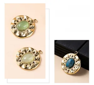 Detailed view of round stainless steel pendants with sunray edge and natural lapis inlay