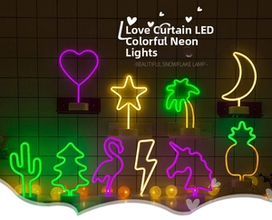 Various LED neon table lamps with festive shapes like cactus and stars on grid wall