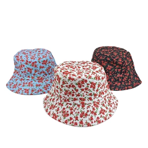 Floral print sun protection bucket hats in light blue, white, and black colors