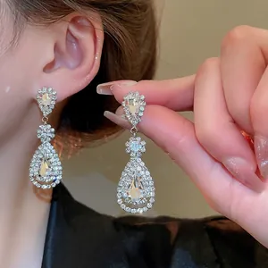 Silver needle waterdrop tassel earrings with vintage rhinestone design for women