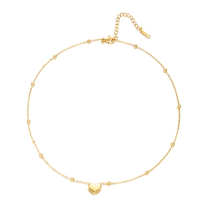 Detail of 18K gold-plated stainless steel beaded necklace with a 3D heart pendant