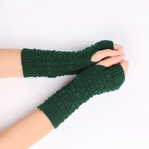 Winter knitted fingerless gloves in forest green with thick cable knit texture