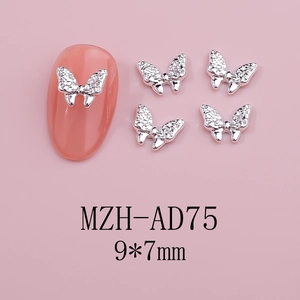 Silver hollow butterfly nail charms with 9x7mm size detail on pink nail tips