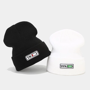 Set of black and white knitted beanies with 1% and 99% battery percentage embroidery