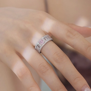 Macro shot of 925 silver ring featuring pink ice-cut stone and micro-paved zircons