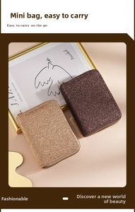 Close-up of glitter-textured double-zipper card holders in gold and brown finishes