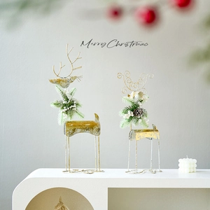 Christmas reindeer iron tabletop ornaments in vintage gold with pine and berry accents