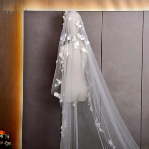 Detail of a 3m long bridal veil with 3D handmade flowers and pearl embellishments